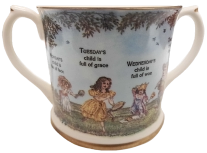 Monday's Child Mug. Short two handled mug with paintings of toys and children inside.