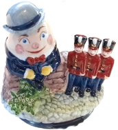 Humpty Dumpty (02/084) 2.75" tall x 2.5" long. Dated 1999 on side of the brick wall. Inside base/lid: "All the King's horses and all the King's men Couldn't put Humpty together again." with painted soldiers and hobby horses.